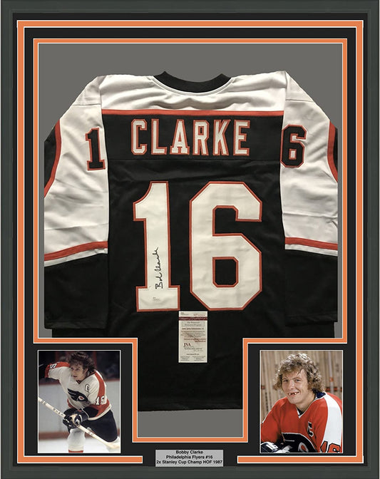 Framed Autographed/Signed Bob Bobby Clarke 35x39 Philadelphia Black Hockey Jersey JSA COA