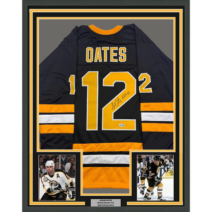 Framed Autographed/Signed Adam Oates 35x39 "HOF 12" Boston Black Hockey Jersey Beckett BAS COA