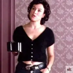 Black V-neck Sweater Worn in Cof­fee Scene of Vi­o­let (Jen­nifer Tilly)