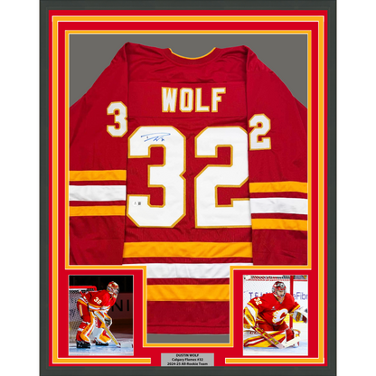 Framed Autographed/Signed Dustin Wolf 35x39 Calgary Red Hockey Jersey Beckett BAS COA