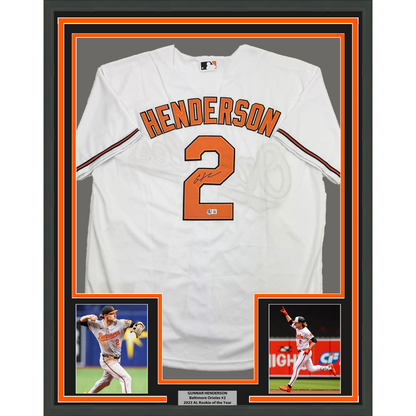 Framed Autographed/Signed Gunnar Henderson 35x39 Baltimore White Baseball Jersey Beckett BAS COA
