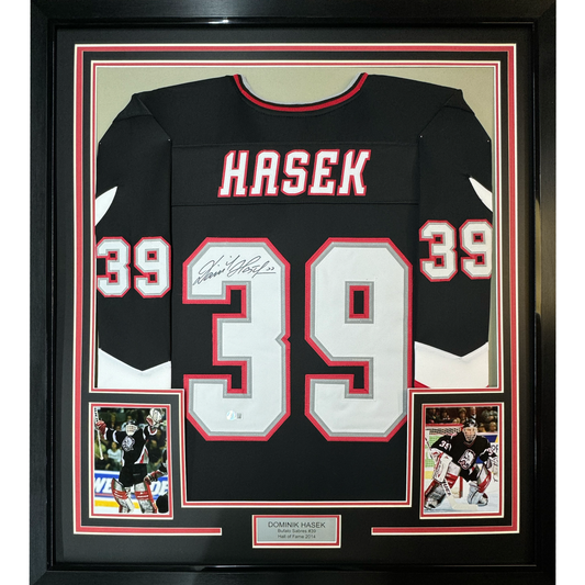 Framed Autographed/Signed Dominik Hasek 35x39 Buffalo Black Hockey Jersey Beckett BAS COA
