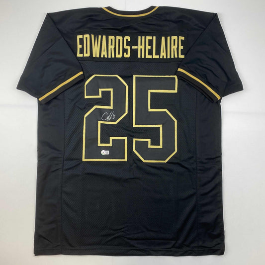 Autographed/Signed Clyde Edwards-Helaire Kansas City Blackout Football Jersey Beckett BAS COA