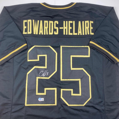Autographed/Signed Clyde Edwards-Helaire Kansas City Blackout Football Jersey Beckett BAS COA