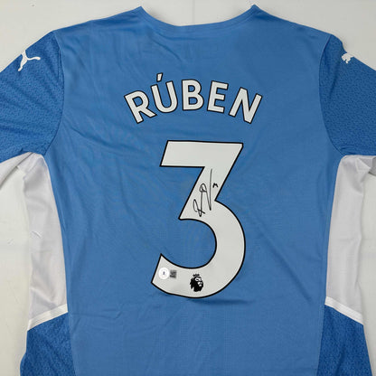 Autographed/Signed Ruben Dias Manchester City Blue Soccer Futbol Jersey Beckett BAS COA