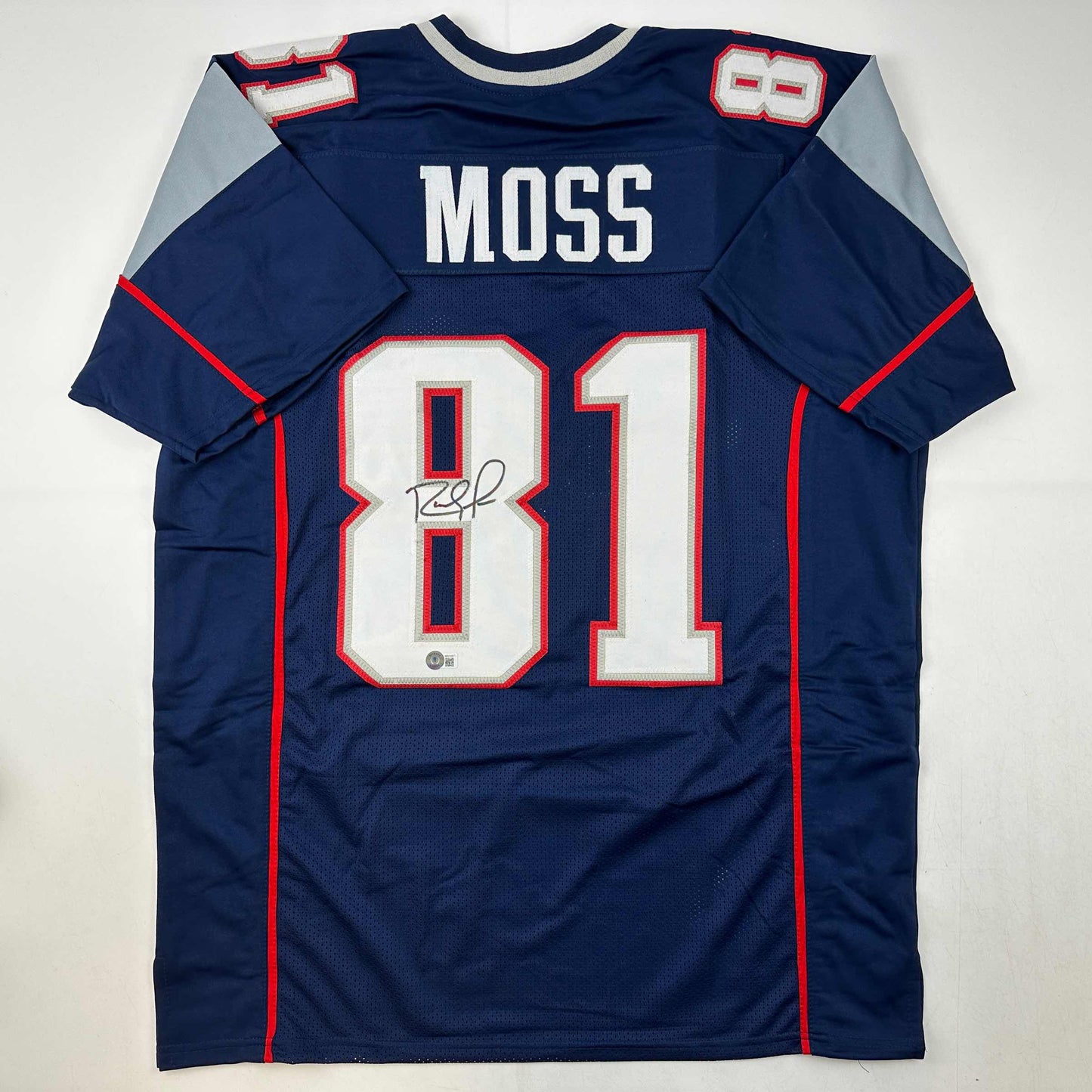 Autographed/Signed Randy Moss New England Blue Football Jersey Beckett BAS COA
