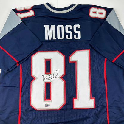 Autographed/Signed Randy Moss New England Blue Football Jersey Beckett BAS COA