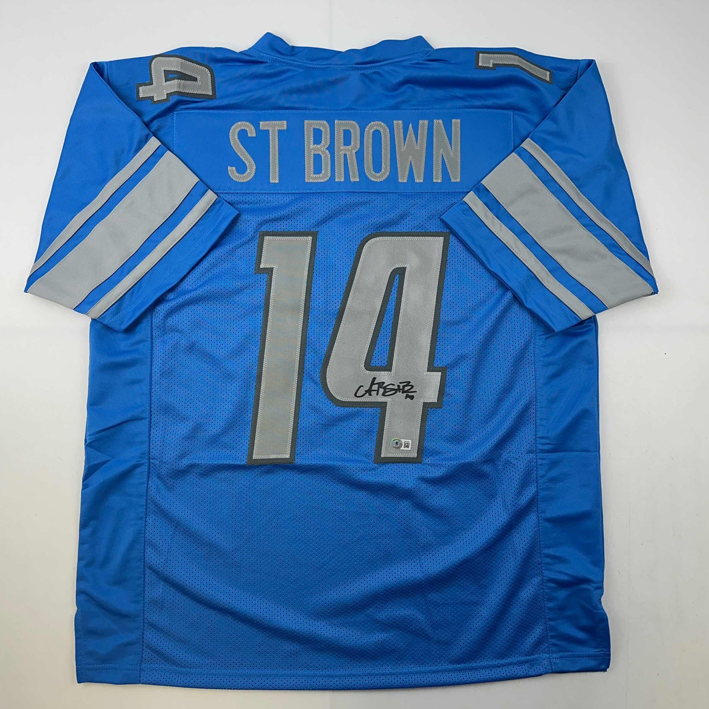 Autographed/Signed Amon-Ra St. Brown Detroit Blue Football Jersey Beckett BAS COA