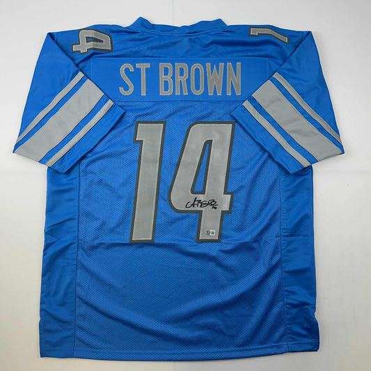 Autographed/Signed Amon-Ra St. Brown Detroit Blue Football Jersey Beckett BAS COA