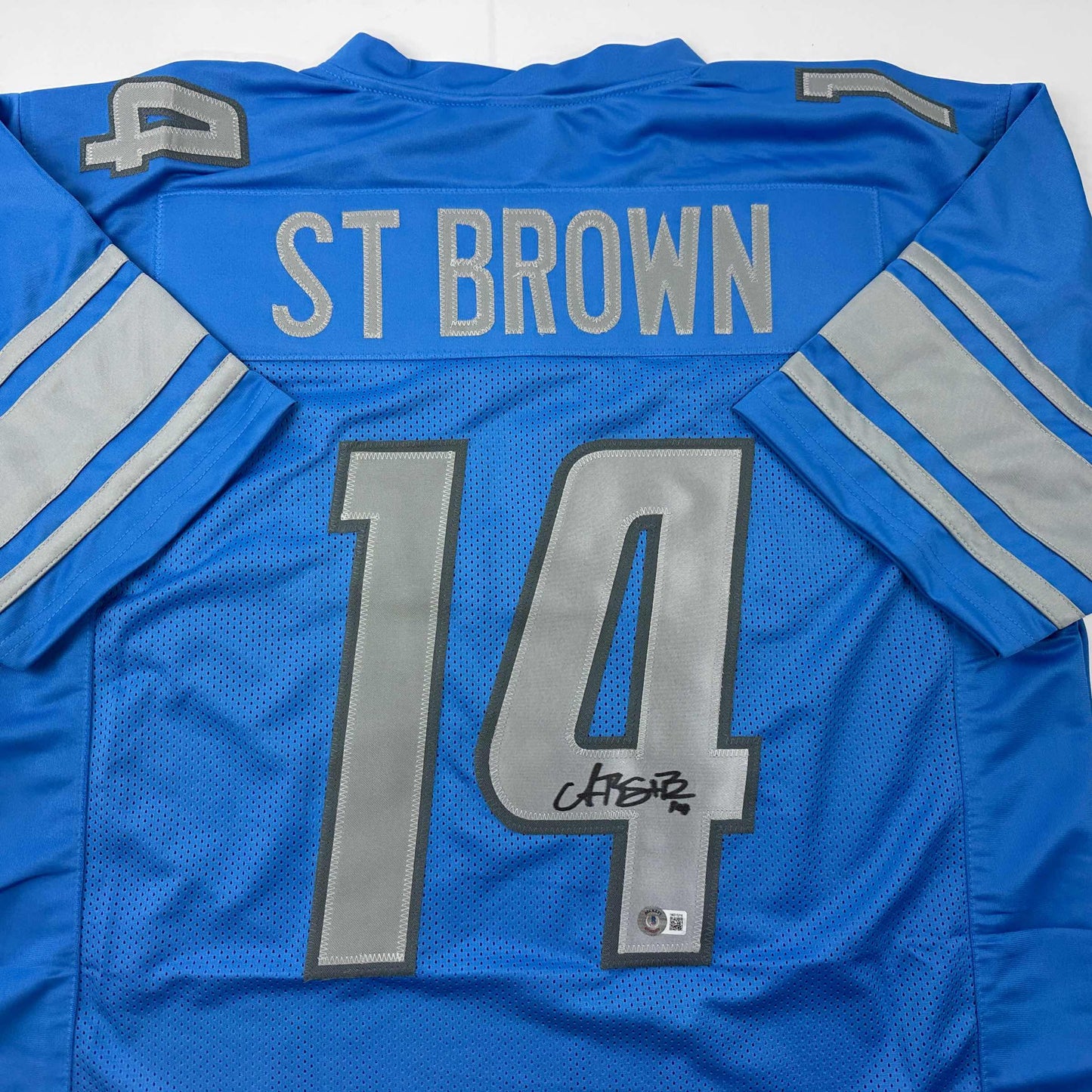 Autographed/Signed Amon-Ra St. Brown Detroit Blue Football Jersey Beckett BAS COA