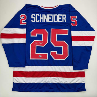 Autographed/Signed Buzz Schneider Blue Team USA Miracle On Ice 1980 Olympics Hockey Jersey Beckett BAS COA