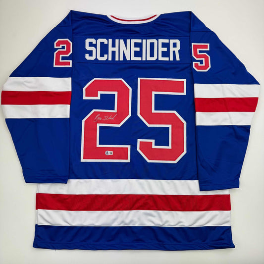 Autographed/Signed Buzz Schneider Blue Team USA Miracle On Ice 1980 Olympics Hockey Jersey Beckett BAS COA