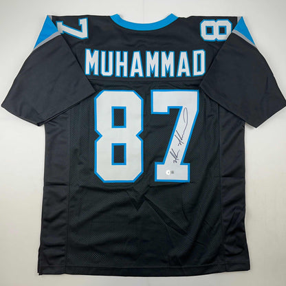 Autographed/Signed Muhsin Muhammad Carolina Black Football Jersey Beckett BAS COA