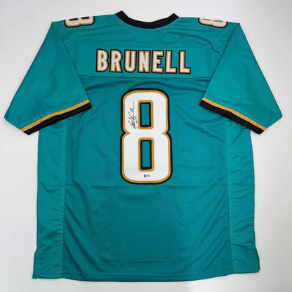 Autographed/Signed Mark Brunell Jacksonville Teal Football Jersey Beckett BAS COA