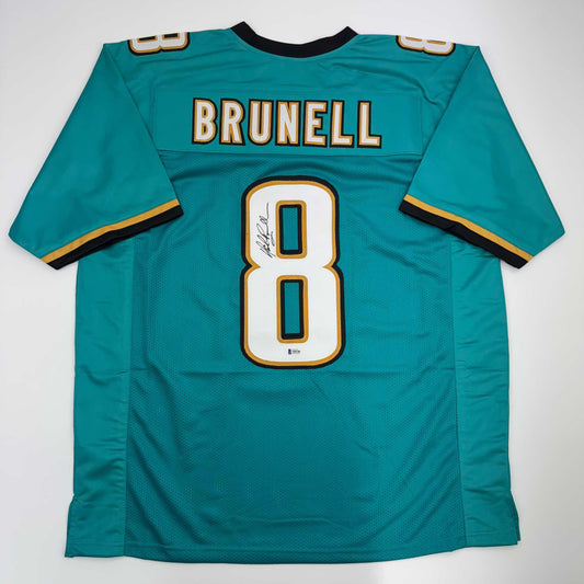 Autographed/Signed Mark Brunell Jacksonville Teal Football Jersey Beckett BAS COA