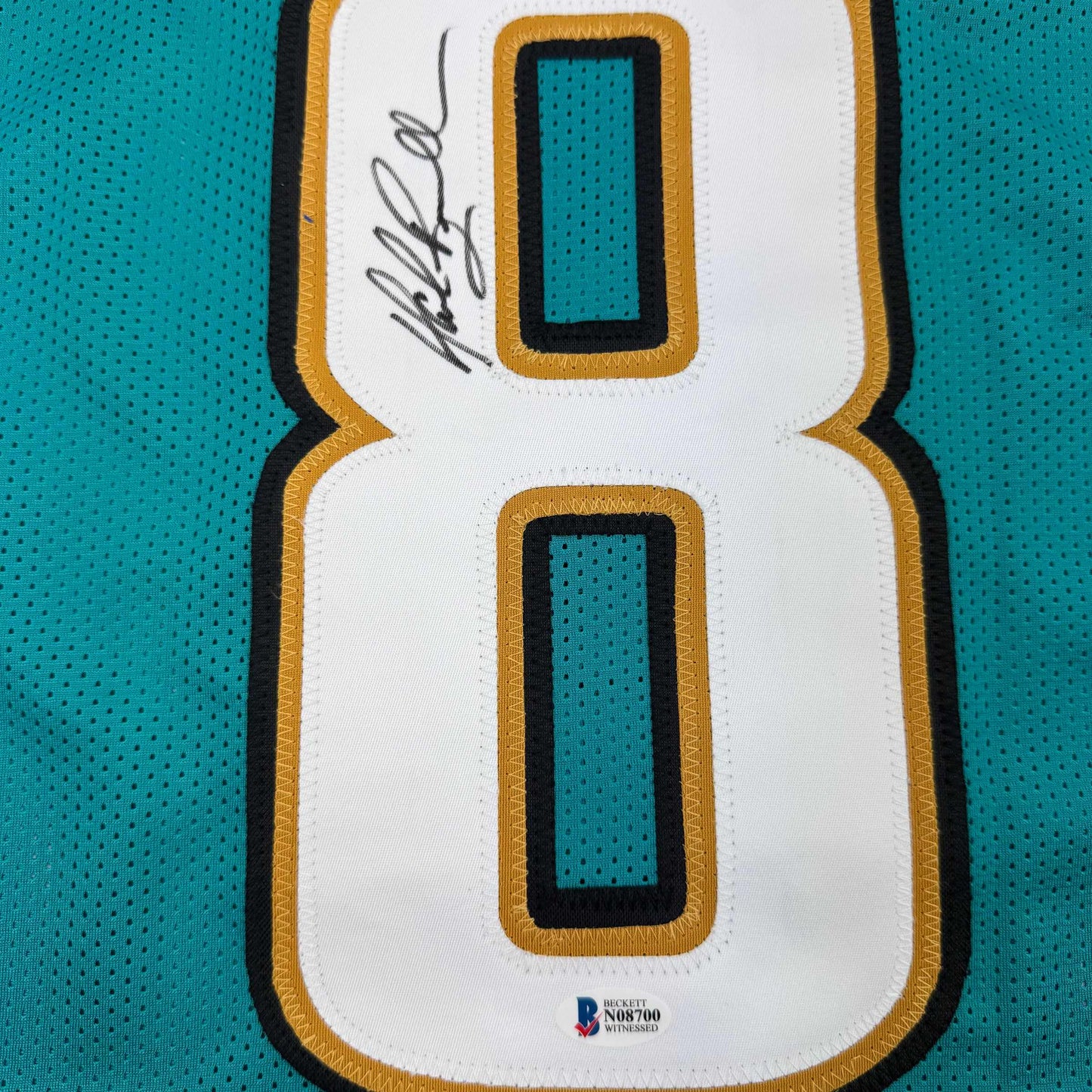 Autographed/Signed Mark Brunell Jacksonville Teal Football Jersey Beckett BAS COA