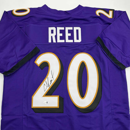 Autographed/Signed Ed Reed Baltimore Purple Football Jersey Beckett BAS COA