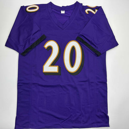 Autographed/Signed Ed Reed Baltimore Purple Football Jersey Beckett BAS COA