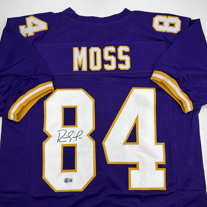 Autographed/Signed Randy Moss Minnesota Purple Football Jersey Beckett BAS COA