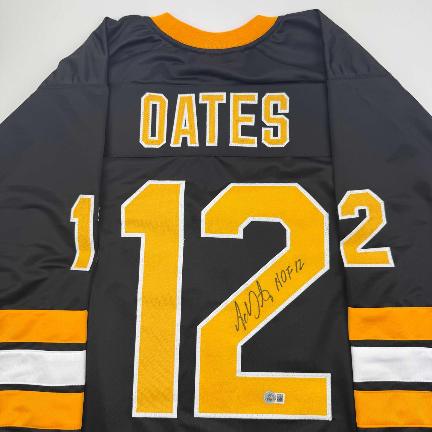 Autographed/Signed Adam Oates "HOF 12" Boston Black Hockey Jersey Beckett BAS COA