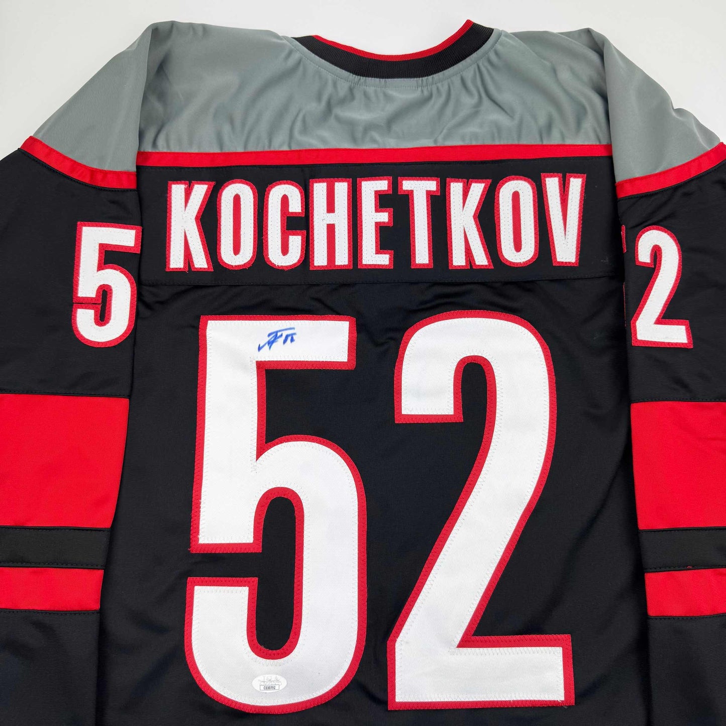 Autographed/Signed Pyotr Kochetkov Carolina Black Hockey Jersey JSA COA