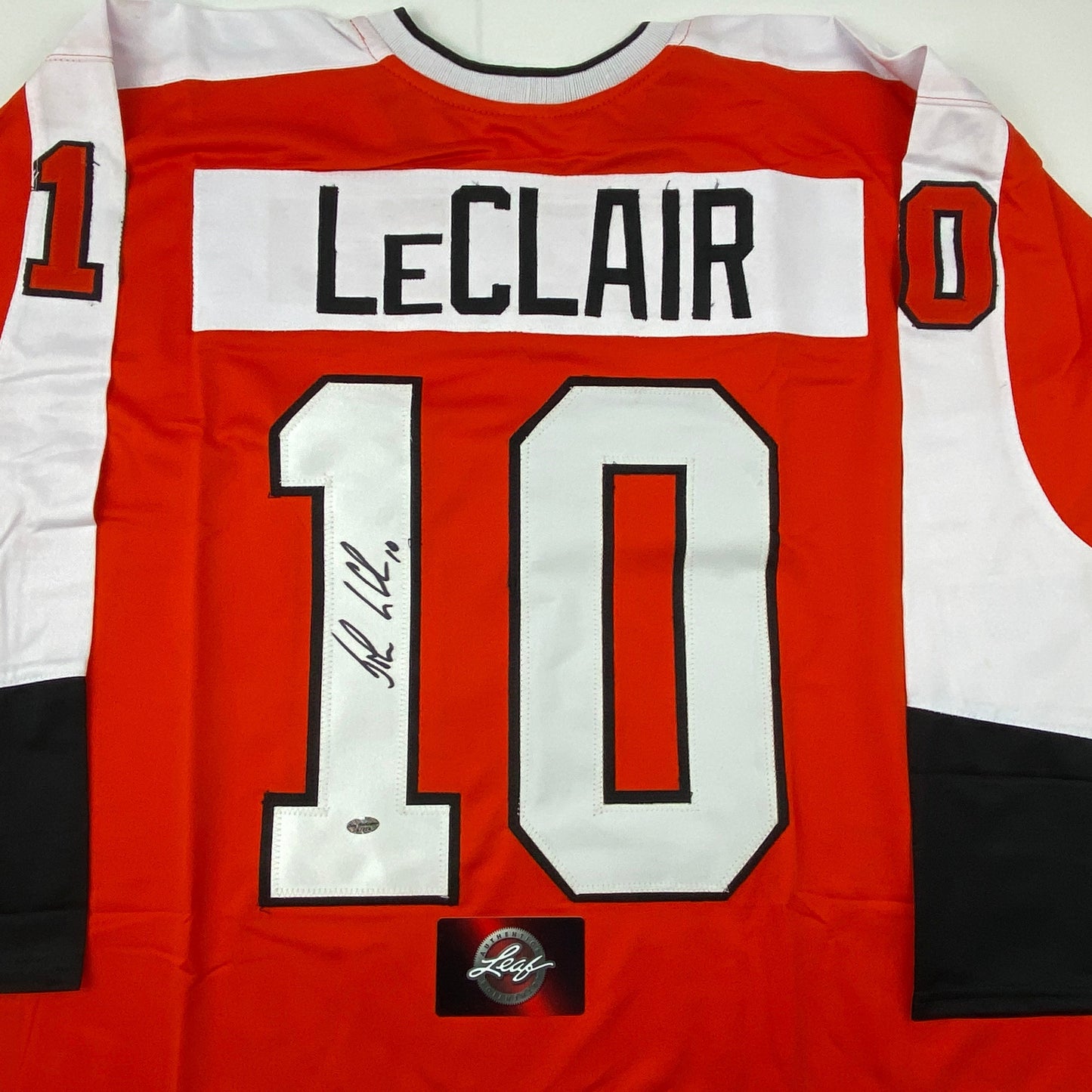 Autographed/Signed John LeClair Philadelphia Orange Hockey Jersey Leaf Authentics COA