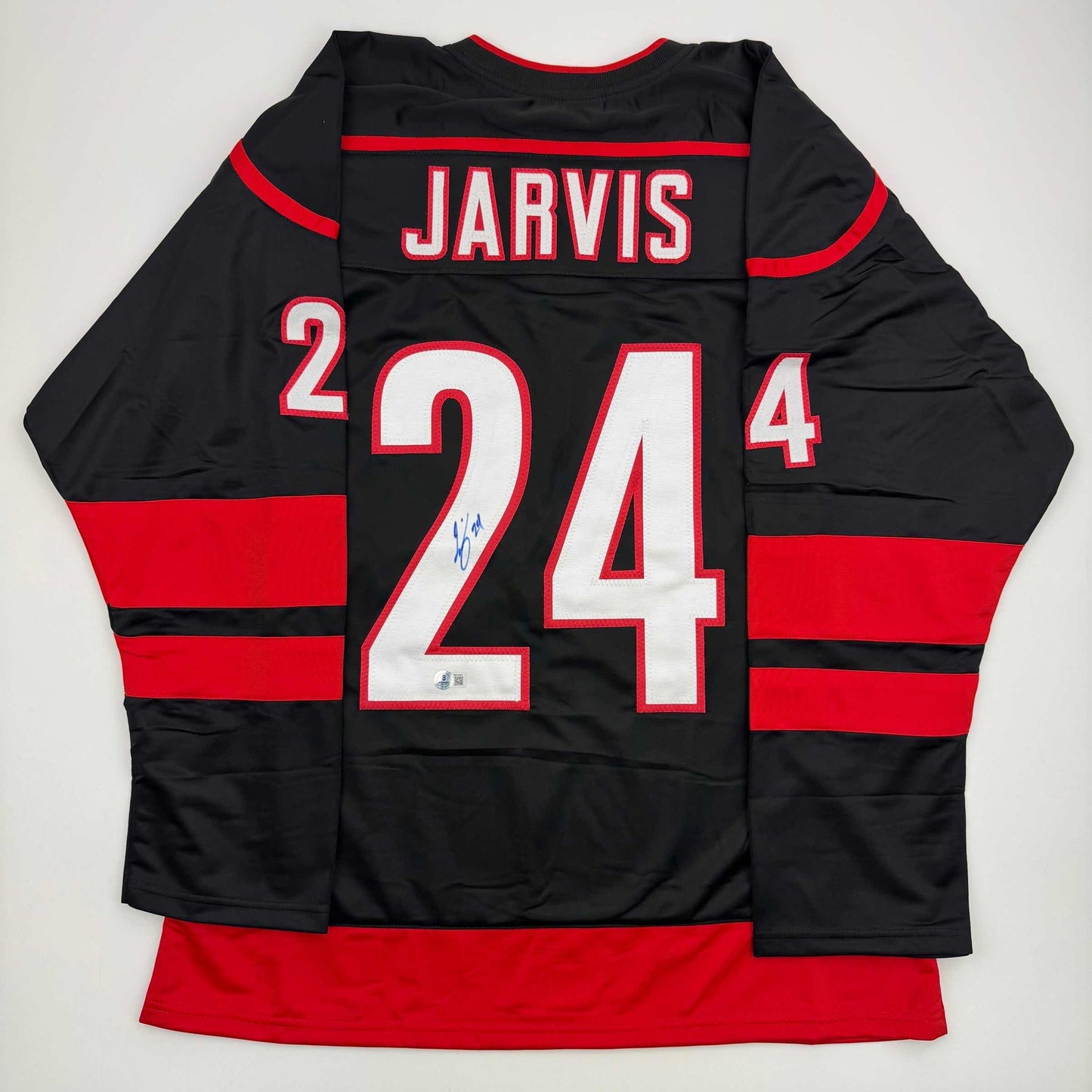 Autographed/Signed Seth Jarvis Carolina Black Hockey Jersey Beckett BAS COA