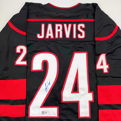 Autographed/Signed Seth Jarvis Carolina Black Hockey Jersey Beckett BAS COA