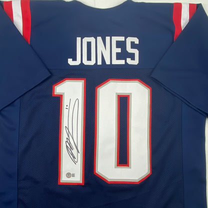Autographed/Signed Mac Jones New England Blue Football Jersey Beckett BAS COA