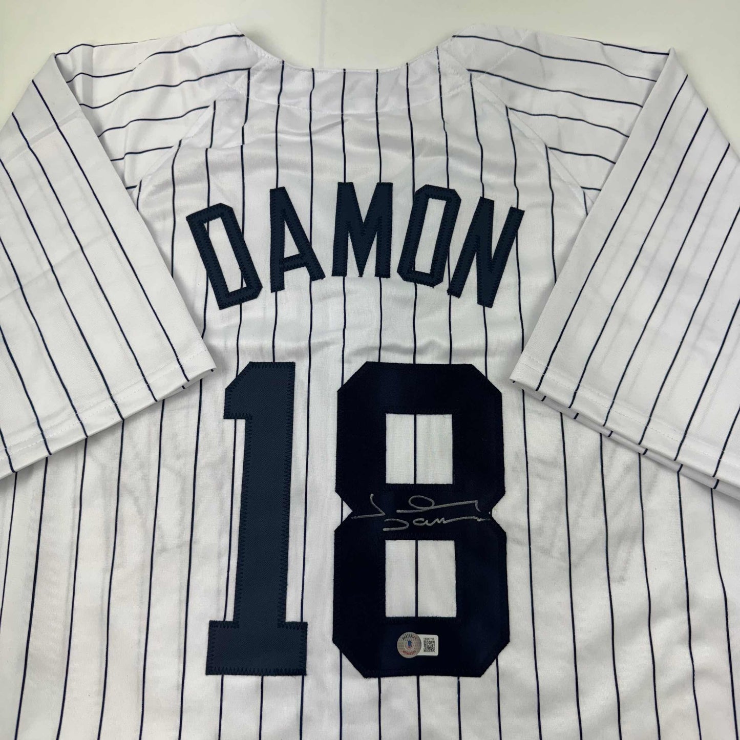 Autographed/Signed Johnny Damon New York Pinstripe Baseball Jersey Beckett BAS COA