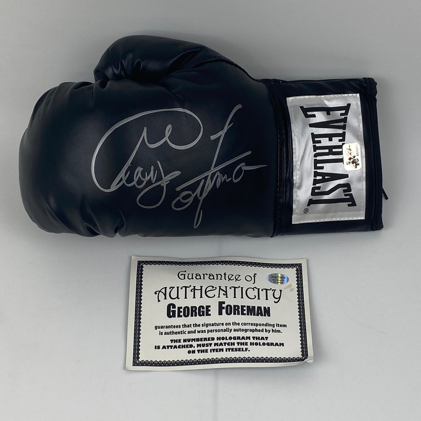 Autographed/Signed George Foreman Black Everlast Boxing Glove Athlete Hologram COA