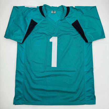 Autographed/Signed Travis Etienne Jr. Jacksonville Teal Football Jersey Beckett BAS COA
