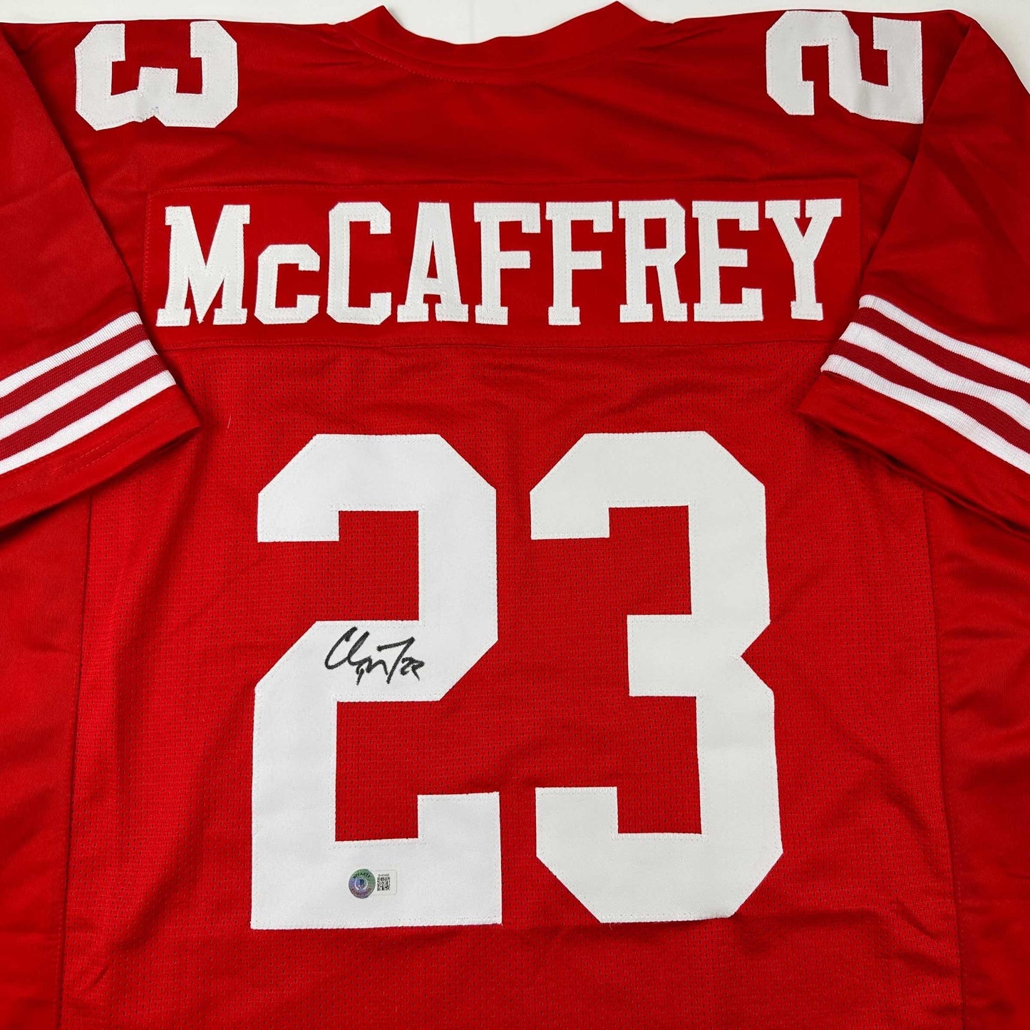 Autographed/Signed Christian McCaffrey San Francisco Red Football Jersey Beckett BAS COA