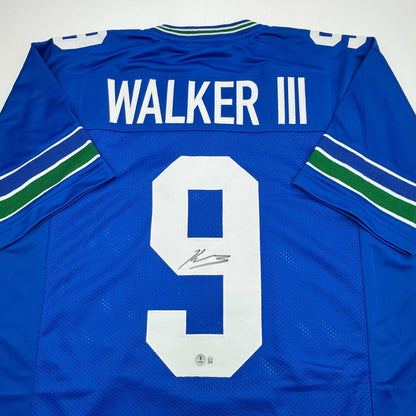 Autographed/Signed Kenneth Walker Seattle Retro Blue Football Jersey Beckett BAS COA
