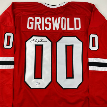 Autographed/Signed Chevy Chase Clark Griswold Christmas Vacation Movie Chicago Red Hockey Jersey Beckett BAS COA