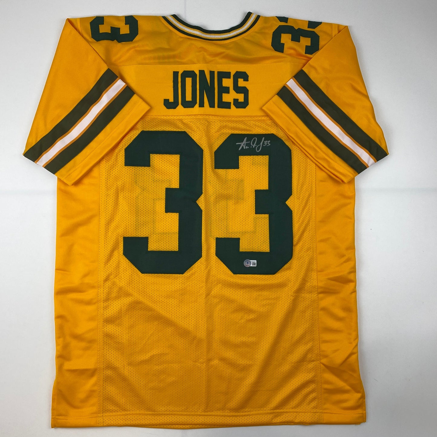 Autographed/Signed Aaron Jones Green Bay Yellow Football Jersey Beckett BAS COA