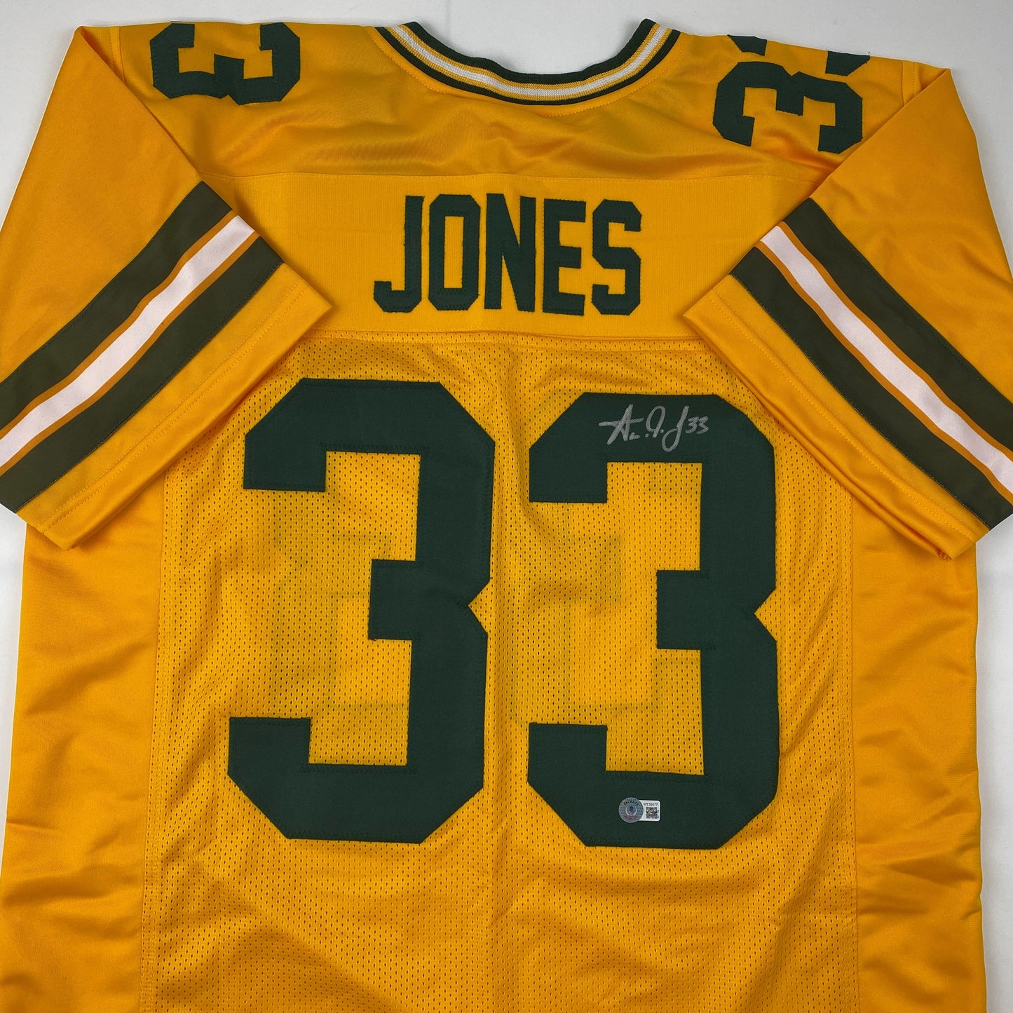 Autographed/Signed Aaron Jones Green Bay Yellow Football Jersey Beckett BAS COA