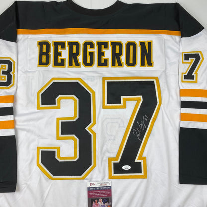 Autographed/Signed Patrice Bergeron Boston White Hockey Jersey JSA COA