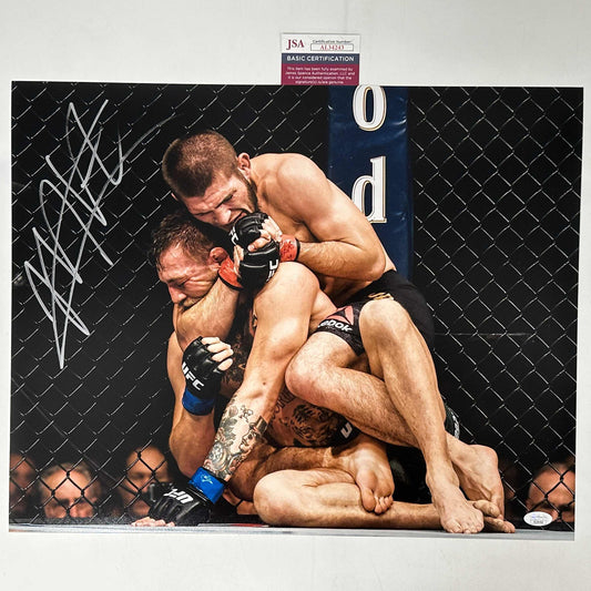 Autographed/Signed Khabib Nurmagomedov vs. Conor McGregor UFC MMA Ultimate Fighting 16x20 Photo JSA COA #1
