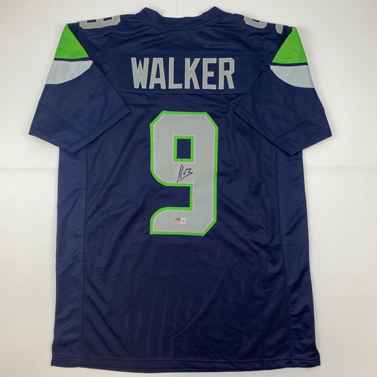 Autographed/Signed Kenneth Walker Seattle Blue Football Jersey Beckett BAS COA