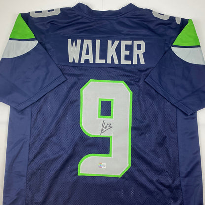 Autographed/Signed Kenneth Walker Seattle Blue Football Jersey Beckett BAS COA