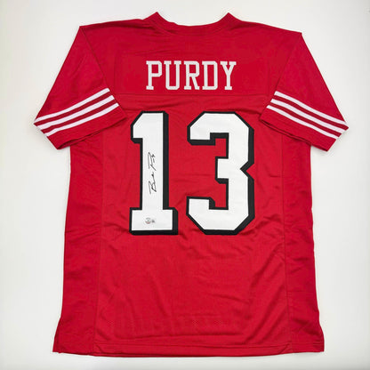 Autographed/Signed Brock Purdy San Francisco Red Alternate Football Jersey Beckett BAS COA