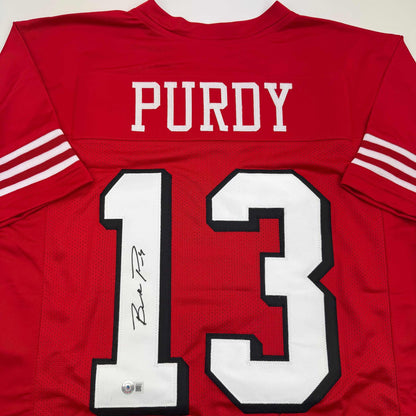 Autographed/Signed Brock Purdy San Francisco Red Alternate Football Jersey Beckett BAS COA