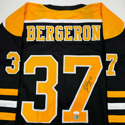 Autographed/Signed Patrice Bergeron Boston Black Hockey Jersey JSA COA