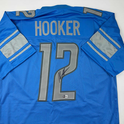 Autographed/Signed Hendon Hooker Detroit Blue Football Jersey Beckett BAS COA