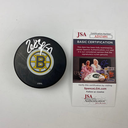 Autographed/Signed Patrice Bergeron Boston Bruins Logo Hockey Puck JSA COA