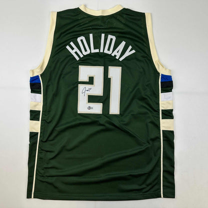Autographed/Signed Jrue Holiday Milwaukee Green Basketball Jersey Beckett BAS COA