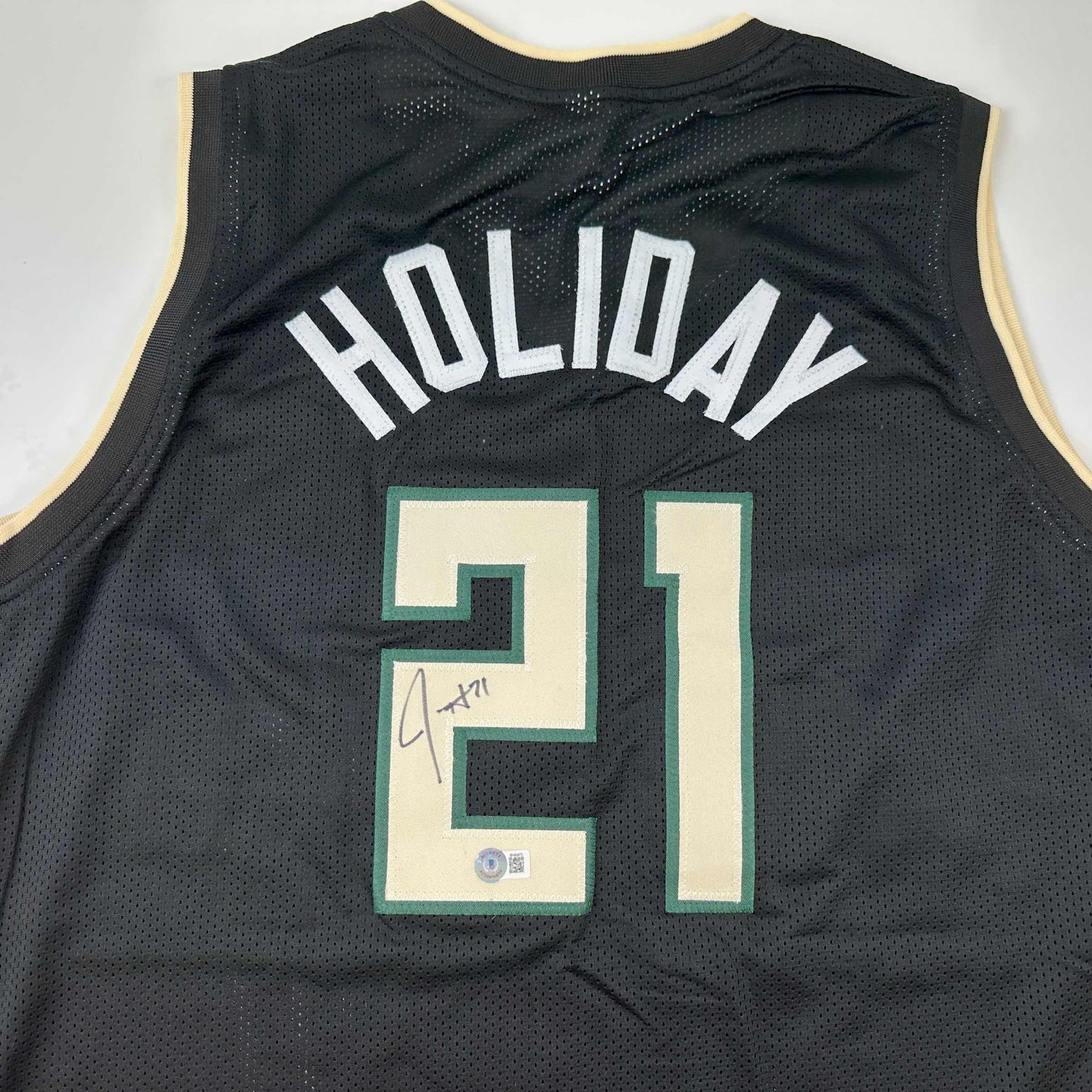 Autographed/Signed Jrue Holiday Milwaukee Black Basketball Jersey Beckett BAS COA