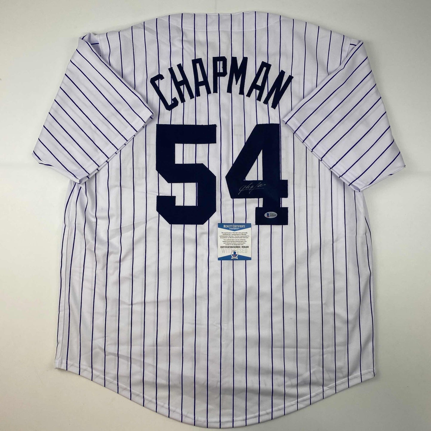 Autographed/Signed Aroldis Chapman New York Pinstripe Baseball Jersey Beckett BAS COA