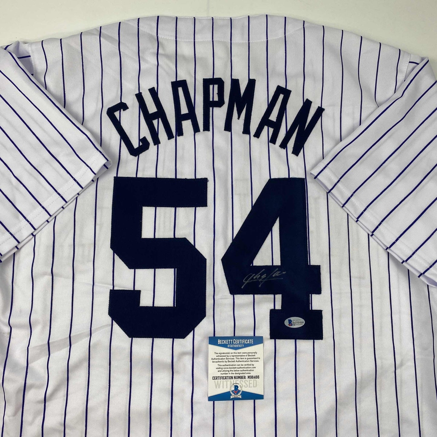 Autographed/Signed Aroldis Chapman New York Pinstripe Baseball Jersey Beckett BAS COA
